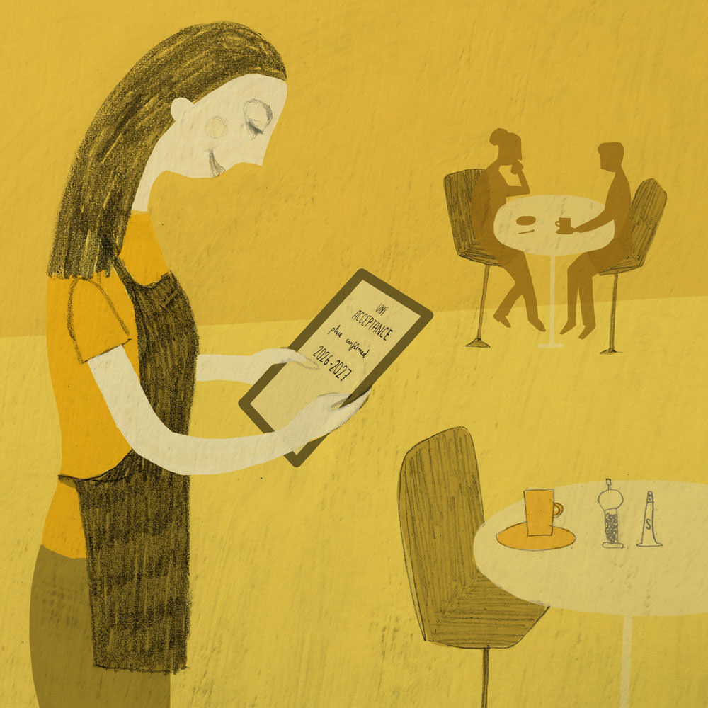 Caitlin in cafe looking at University acceptance message