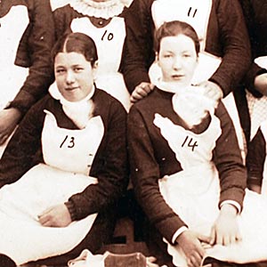 Outside the Wash House 1886 with Mrs. Parker