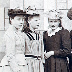 Outside the main door of the School
