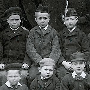 The little boys of Cottage 13, ‘Leven Home’ in the company of Mr & Mrs Lang prior to departure for Canada.
