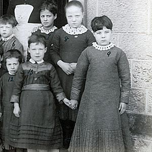 The children of Cottage 3, 'Dalry Home' in the company of Mrs Smith